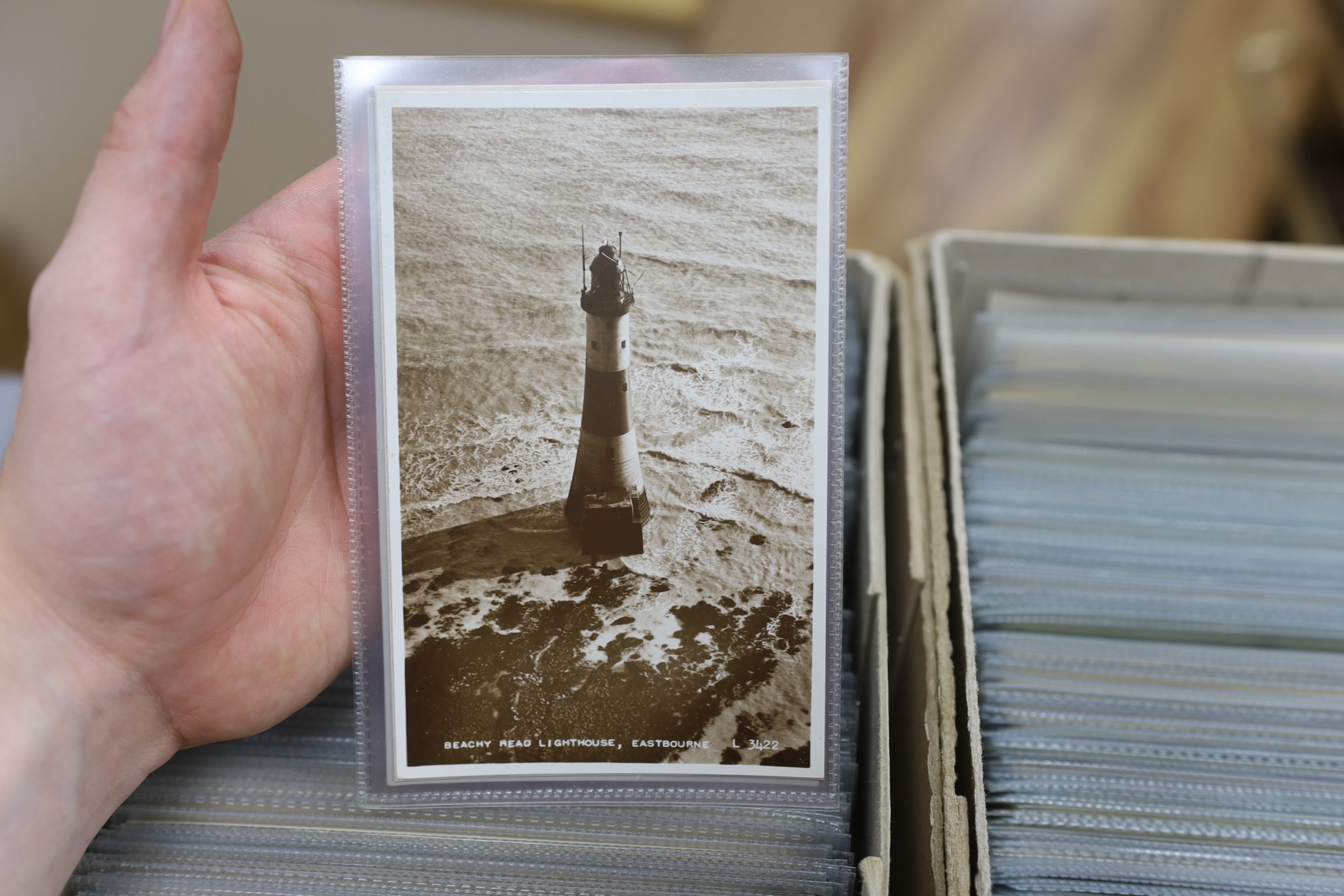 A large quantity of early to mid 20th century postcards of Eastbourne and the surrounding area, all in individual protective sleeves